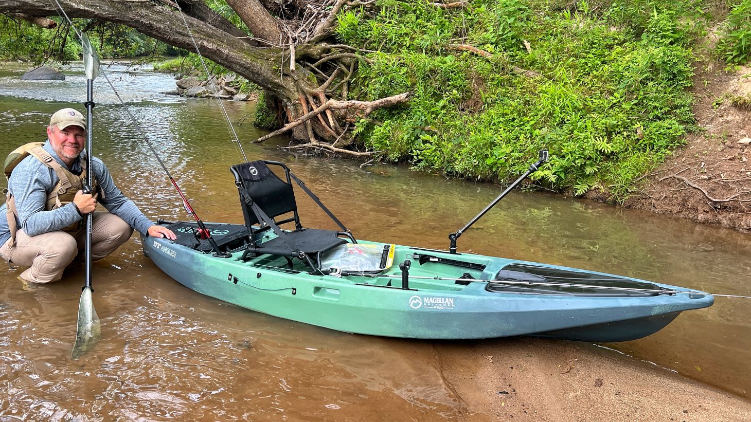 Angler next to kayak