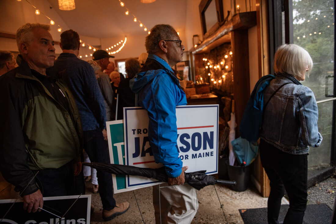 Maine voters leave the 2026 Neil Rolde York-Ogunquit Democrats Celebration Lobster Bake with yard signs on Sept. 13 in York, Maine. Troy Jackson is running against U.S. Sen. Susan Collins, R-Maine, after replacing Graham Platner as the Democratic nominee.
