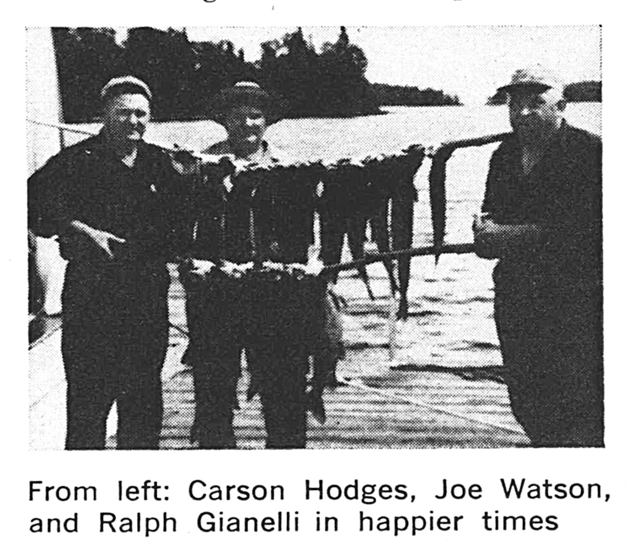 Three men with a mess of fish in an old black and white photo. Ralph Gianelli drowned on Lake Superior in 1971